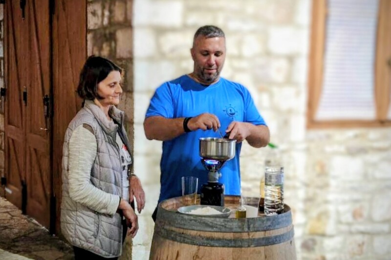 Traditional must pudding preparation in Lantzoi with Wanderlust during a wine tourism activity