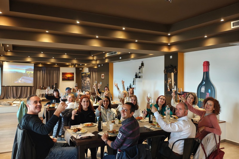 Participants enjoying a wine tasting and local meal at the Abelon Ktima Brintziki tasting room